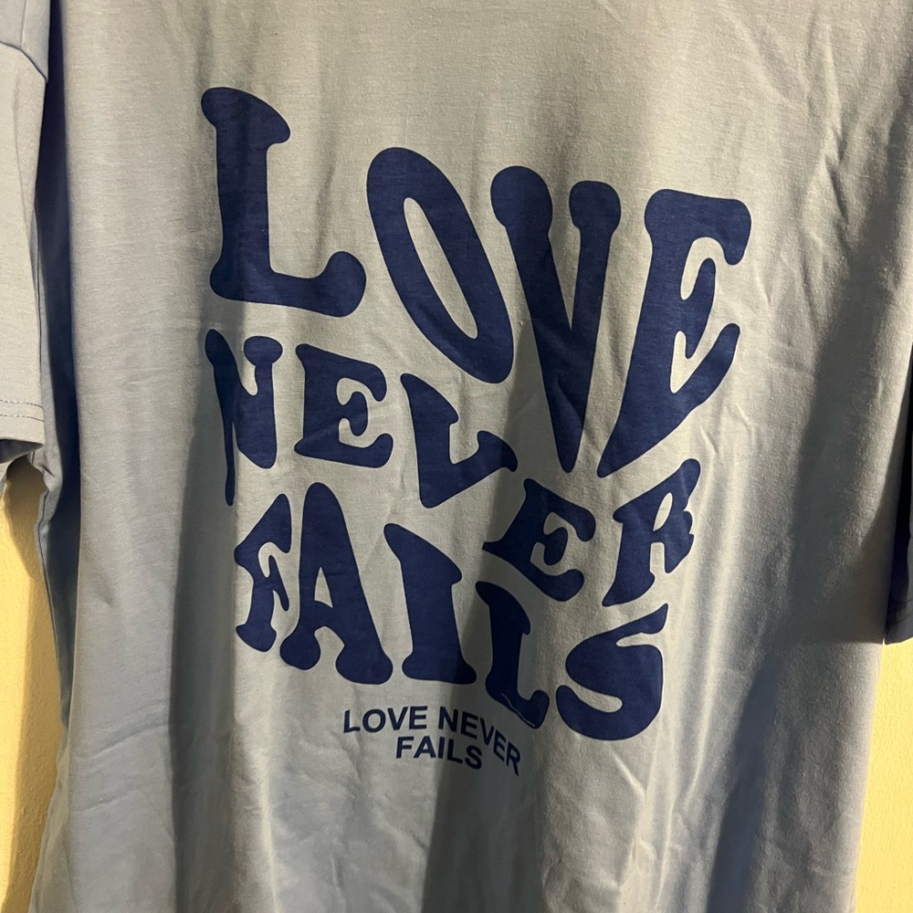 Love Never Fails Graphic Tee